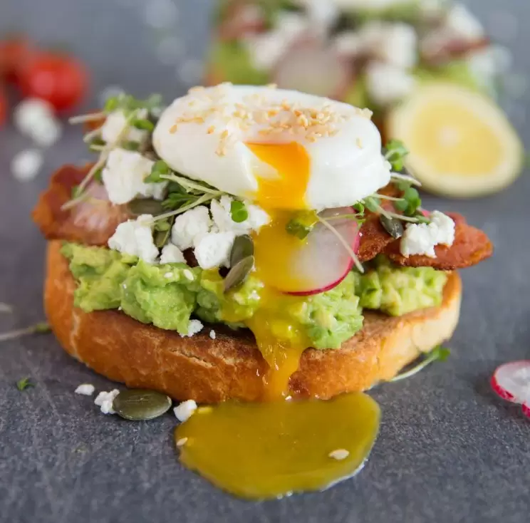 Smashed Avocado on toast with Bacon, Feta and Poached Egg